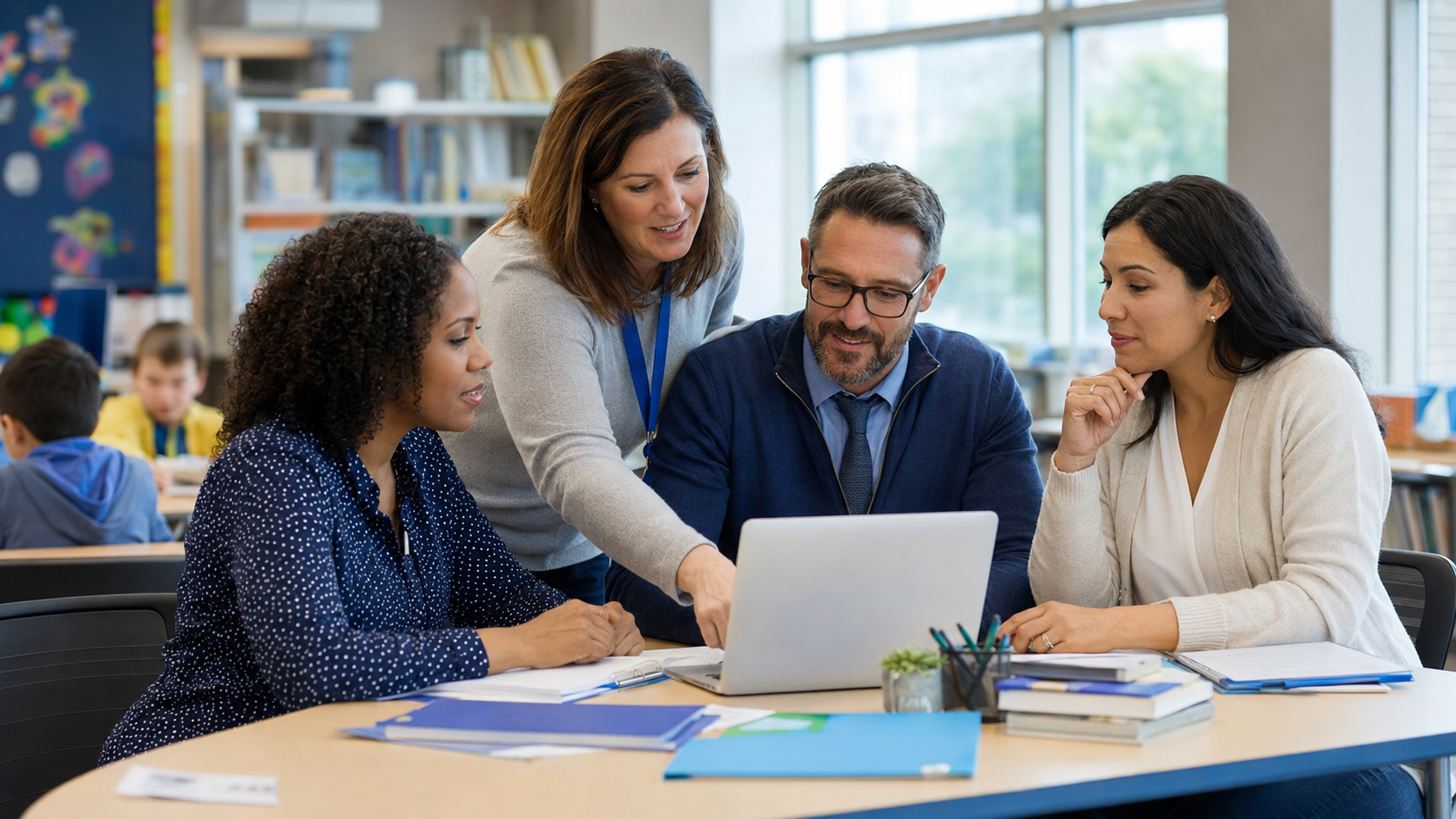 K–12 teachers and school personnel collaborating in a classroom.